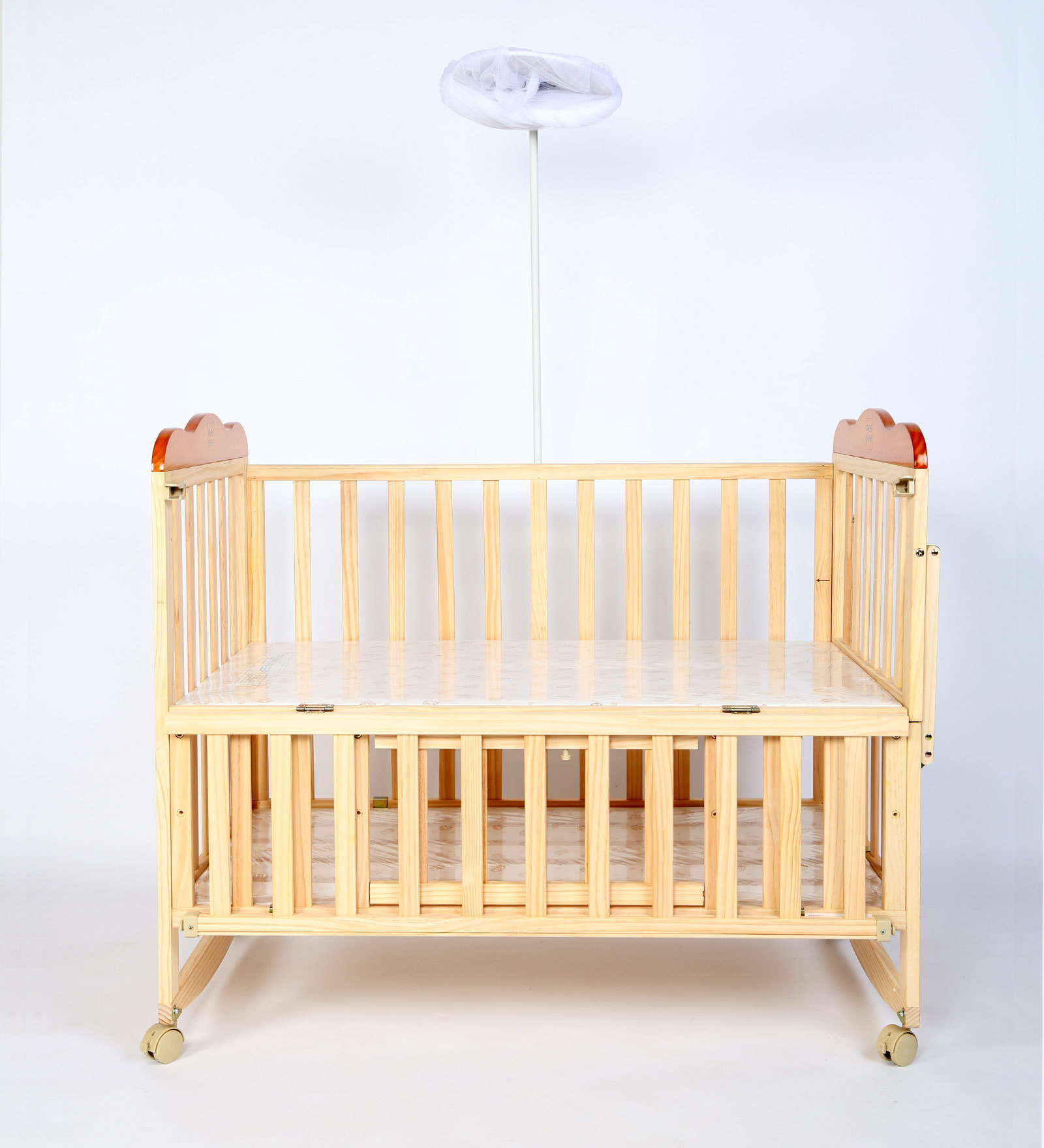 wooden cot with mosquito net