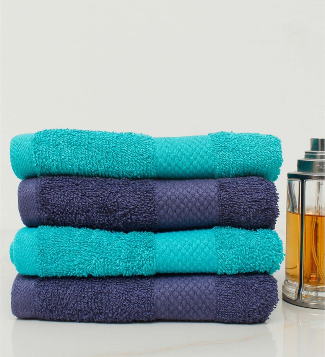 Buy Multicolor Solid 500 GSM 100 Cotton Hand Towels (Set of 4) by AVI